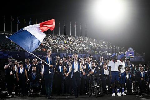 2024 Paralympics Opening Ceremony: France's paralympic flag bearer Nantenin Keita, France's paralympic flag bearer Alexis Hanquinquant and France's delegation during the Opening Ceremony